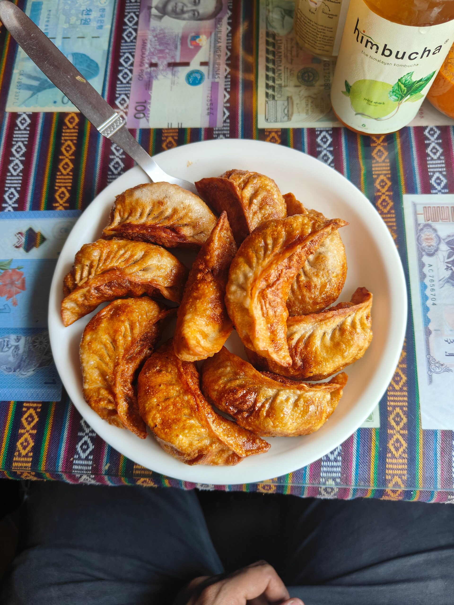 Close-up of delicious golden-brown fried momos in India, showcasing authentic South Asian cuisine.
